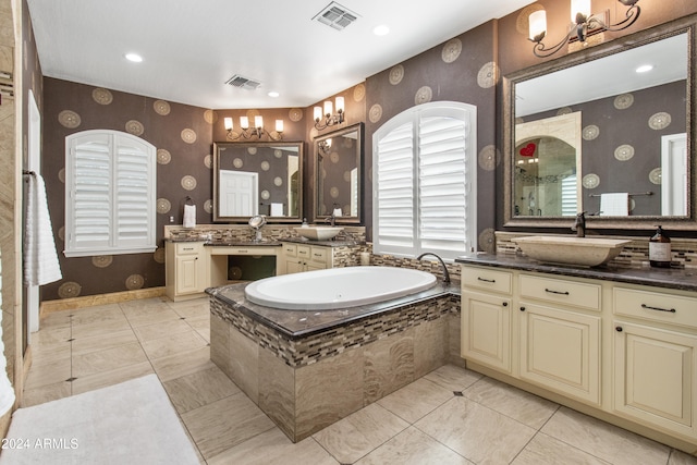 bathroom with vanity and tiled bath