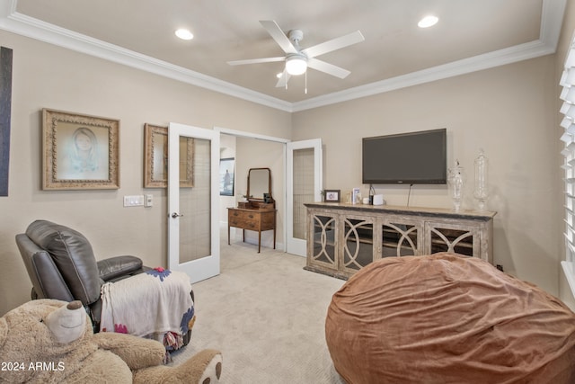 carpeted living room with french doors, ceiling fan, and ornamental molding