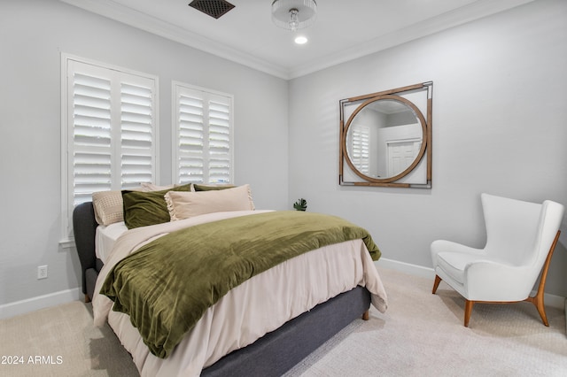 carpeted bedroom with ornamental molding