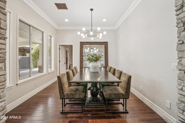 dining area with crown molding, dark wood-type flooring, and an inviting chandelier