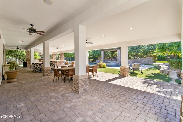 view of patio / terrace featuring ceiling fan