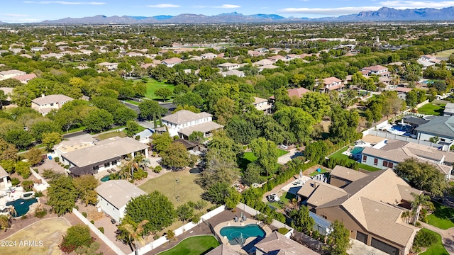 birds eye view of property featuring a mountain view