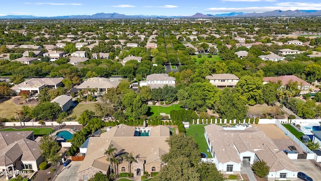 birds eye view of property featuring a mountain view