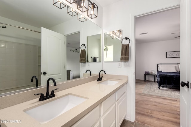 bathroom with vanity and wood-type flooring