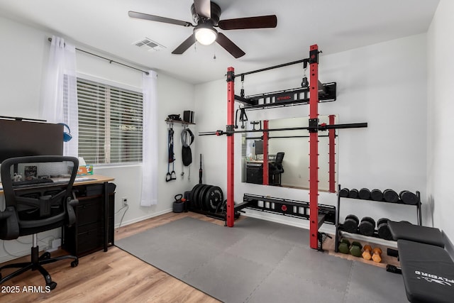 interior space with hardwood / wood-style floors and ceiling fan