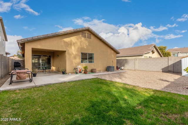 rear view of property with central AC, a patio area, and a lawn