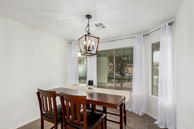 dining space with an inviting chandelier