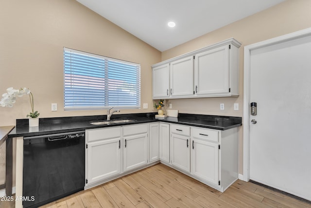 kitchen with dishwasher, sink, white cabinets, and light hardwood / wood-style floors