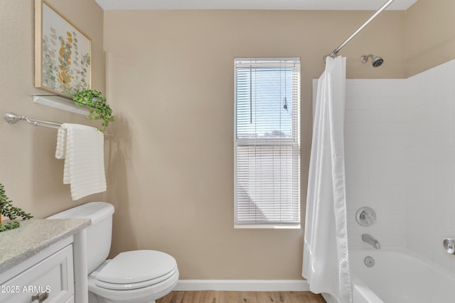 full bathroom with vanity, hardwood / wood-style floors, shower / bathtub combination with curtain, and toilet