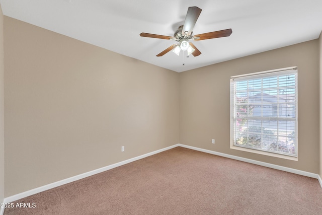 carpeted empty room with ceiling fan