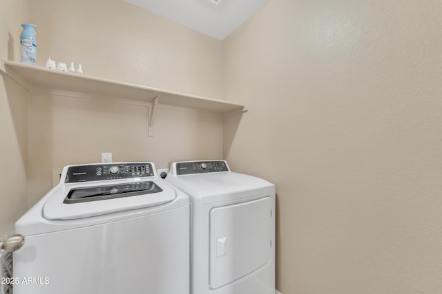 laundry room featuring separate washer and dryer