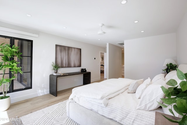 bedroom featuring ceiling fan and light hardwood / wood-style flooring