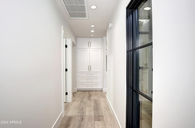 hallway with light wood-type flooring