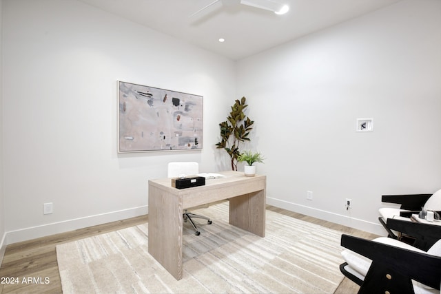 office space featuring ceiling fan and light hardwood / wood-style flooring