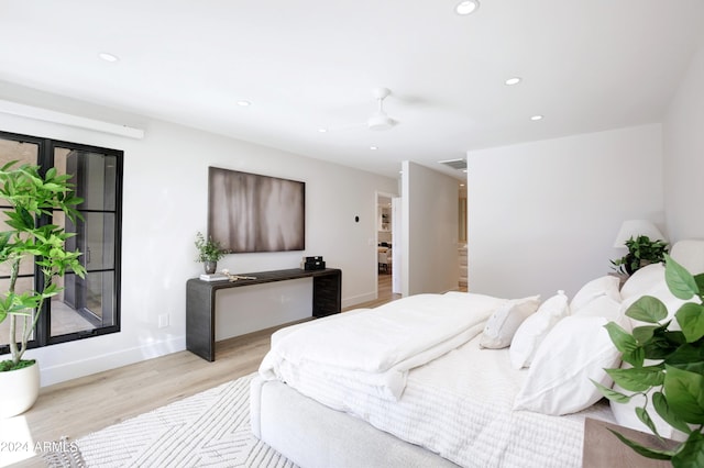 bedroom featuring ceiling fan and light hardwood / wood-style floors