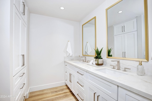 bathroom with vanity and wood-type flooring