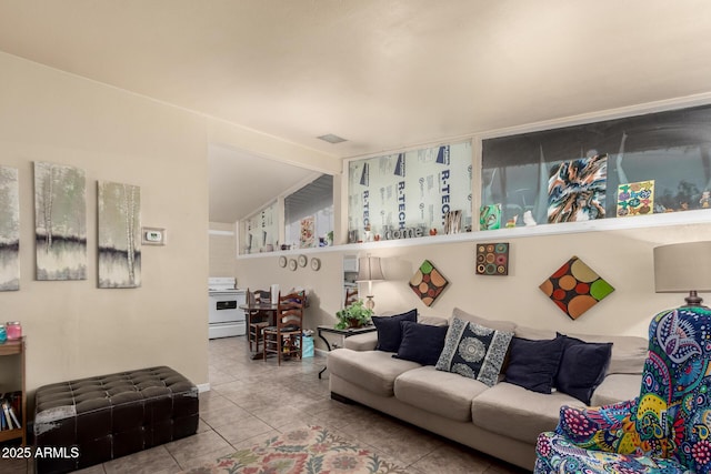 tiled living area featuring lofted ceiling