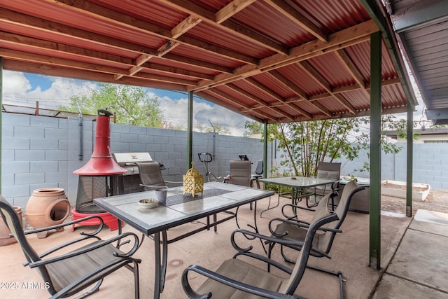 view of patio with outdoor dining area and a fenced backyard