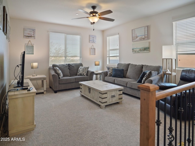 living room with light carpet and ceiling fan