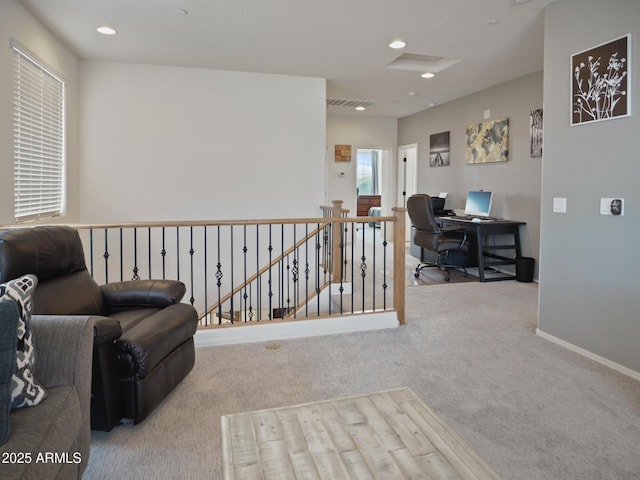 living area featuring light carpet