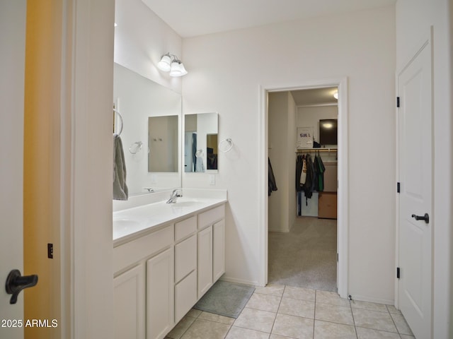 bathroom featuring tile patterned flooring and vanity