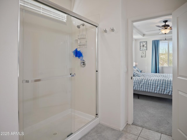 bathroom with an enclosed shower, tile patterned flooring, and ceiling fan