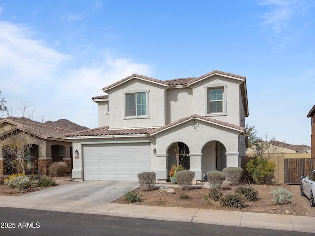 mediterranean / spanish-style house featuring a garage