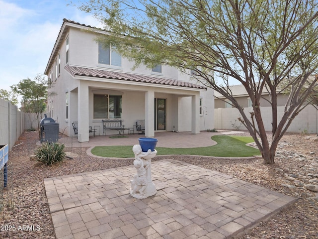 rear view of property with a patio