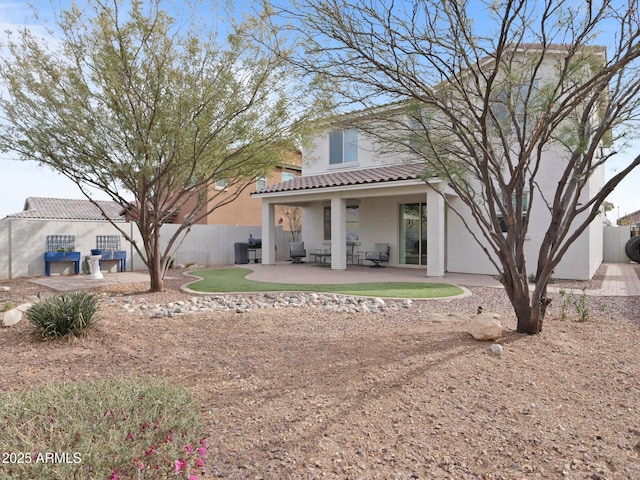 rear view of property with a patio area