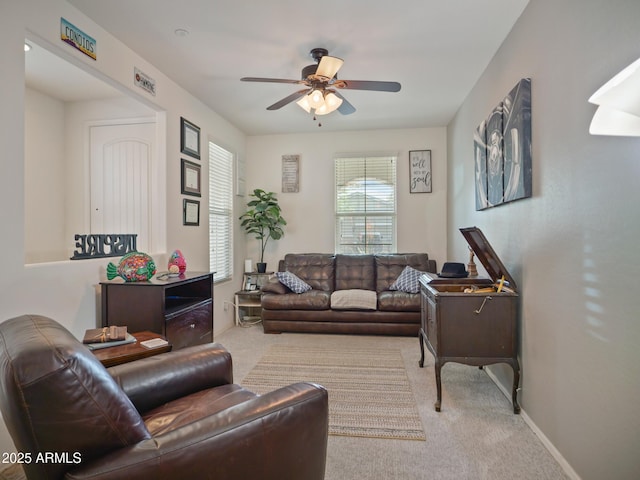 living room with light carpet and ceiling fan