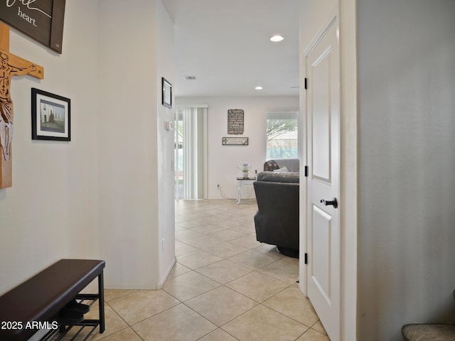 hallway featuring light tile patterned floors