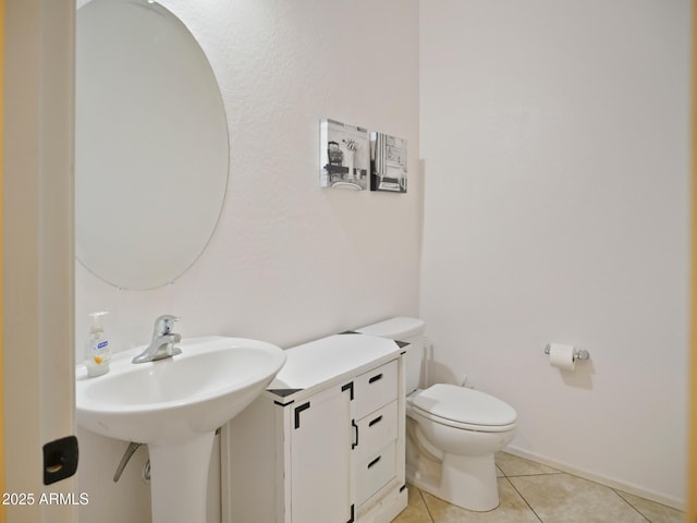 bathroom featuring tile patterned floors and toilet