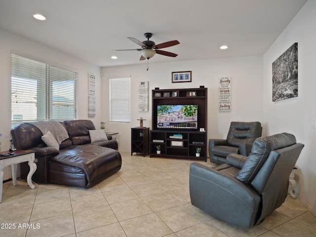 tiled living room with ceiling fan