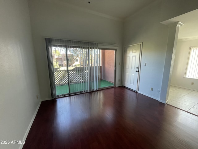 spare room featuring wood-type flooring