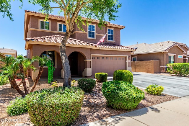 13123 W Cottontail Ln, Peoria, AZ 85383 - mediterranean / spanish home with driveway, a garage, stucco siding, a tiled roof, and fence
