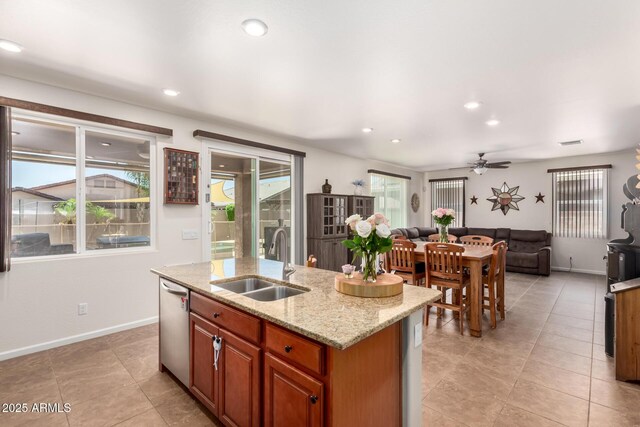 13123 W Cottontail Ln, Peoria, AZ 85383 - kitchen with a sink, stainless steel dishwasher, open floor plan, a kitchen island with sink, and a ceiling fan