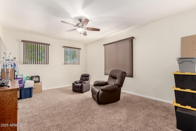 13123 W Cottontail Ln, Peoria, AZ 85383 - living area with carpet flooring, ceiling fan, and baseboards