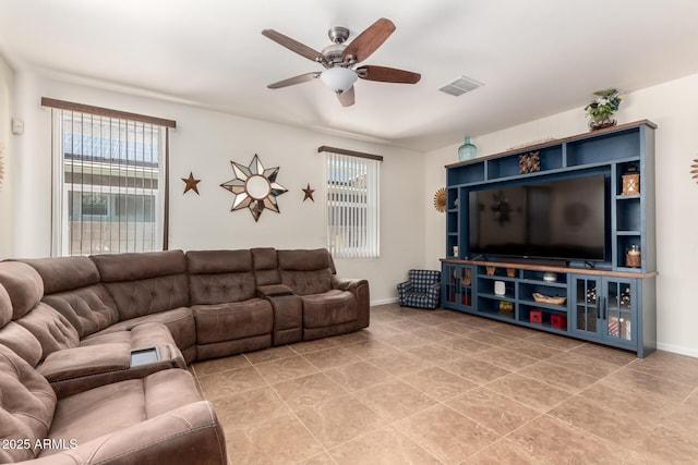 13123 W Cottontail Ln, Peoria, AZ 85383 - living room with a ceiling fan, light tile patterned flooring, and baseboards
