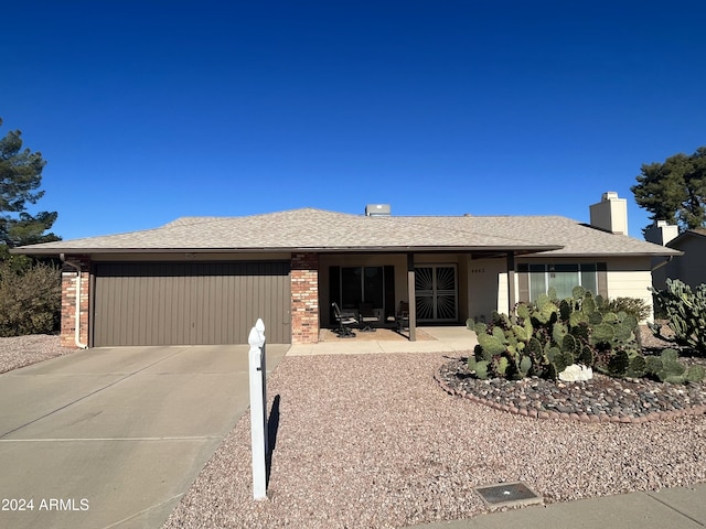 single story home with a garage