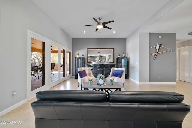 living room with french doors and ceiling fan