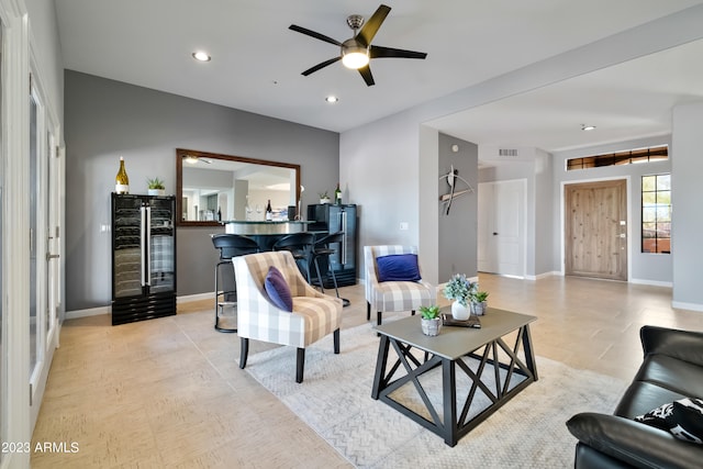 living room with wine cooler and ceiling fan