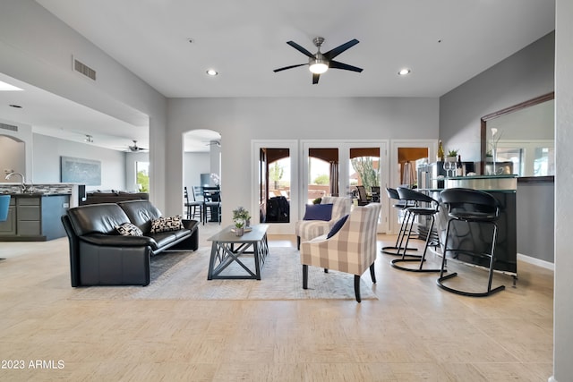 living room with sink and ceiling fan