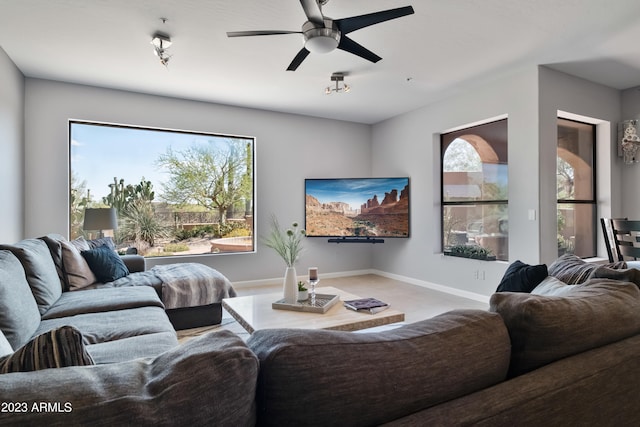 living room with ceiling fan and carpet flooring