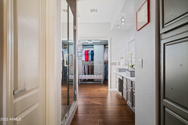 hallway with dark wood-type flooring