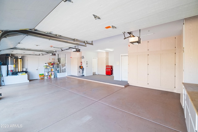 garage featuring a garage door opener and water heater