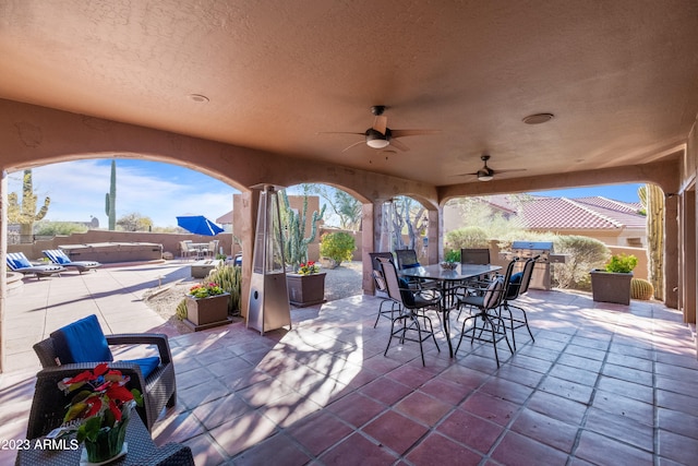 view of patio / terrace featuring ceiling fan