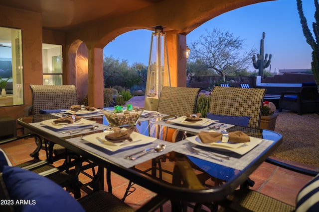 view of patio terrace at dusk