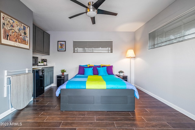 bedroom featuring ceiling fan and refrigerator