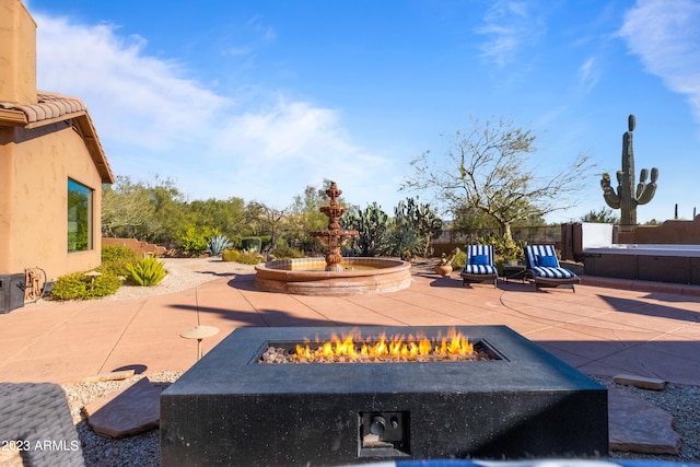 view of patio with a fire pit