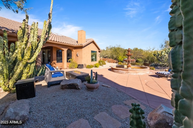 view of patio with an outdoor fire pit